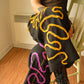 Pantalon vintage noir de seconde main avec motif abstrait composé de laine et de soie brodé et tricoté à la main au Québec par l’artiste Caroline Auger