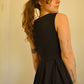 Robe noir de seconde main revalorisée par l'ajout d'un motif de fleur brodée à la main au Québec par l’artiste et designer Caroline Auger.