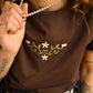 T-shirt vintage brun chocolat avec lacets sur les côtés et broderie fait à la main par l’artiste et désigner québécoise Caroline Auger