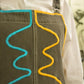 Robe salopette vintage grise en jeans à broderies abstraites fait à la main au Québec par l’artiste Caroline Auger